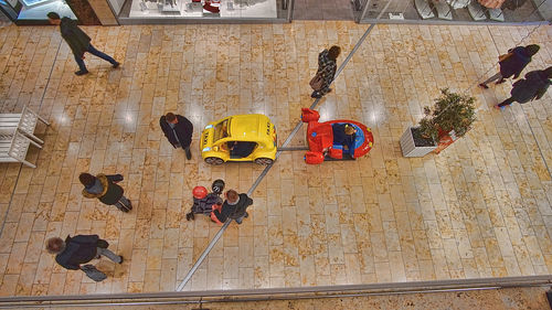 High angle view of people walking on floor