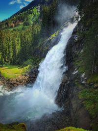 Scenic view of waterfall in forest