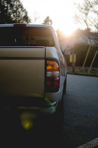 Reflection of car on street in city