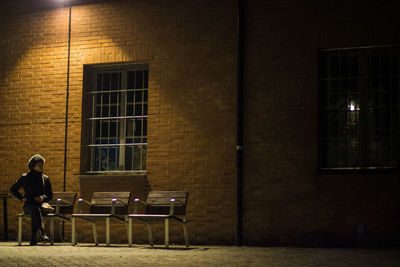 Chairs and table in city at night