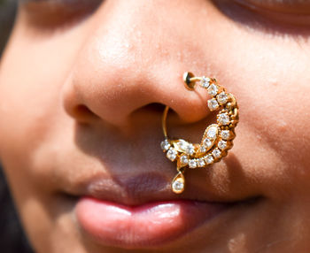 Close-up portrait of girl wearing nose ring