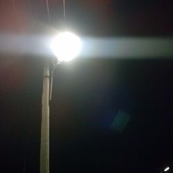 Low angle view of illuminated street light