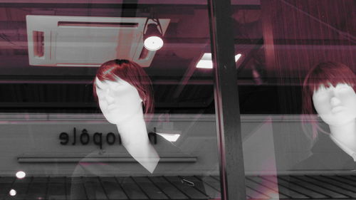 Mannequin at window display in store
