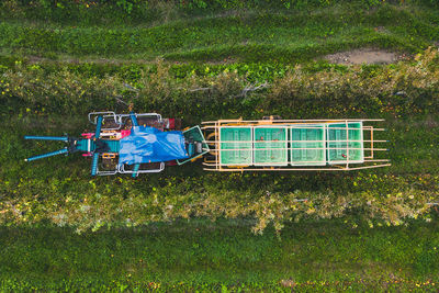 A bird's eye view apple picking machine. in the field, among apple trees. agriculture. agricultural