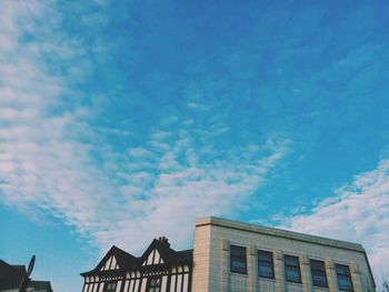 Low angle view of building against blue sky