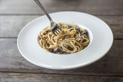 Close-up of noodles in bowl on table