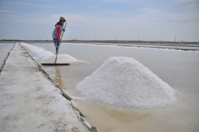 Man working at salt flat