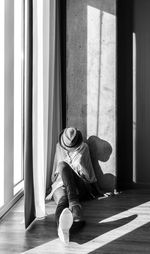 Low section of woman sitting on floor