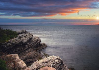 Scenic view of sea against sky during sunset