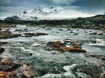 Scenic view of river and mountains