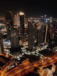 High angle view of illuminated buildings in city at night