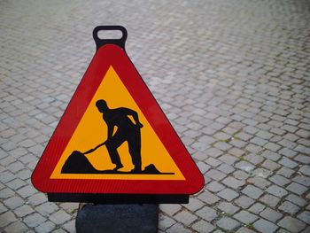 Close-up of road sign on street