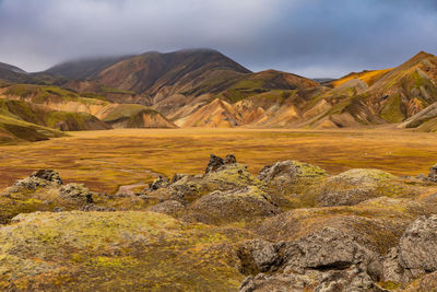 Scenic view of landscape and mountains against sky