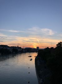 Scenic view of river against sky during sunset