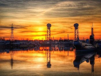 Boats in harbor at sunset