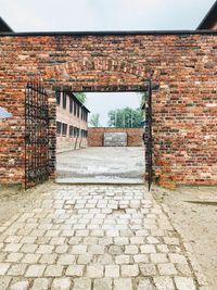 Footpath by wall of building