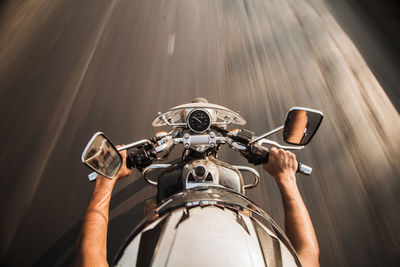 Man riding bicycle on road