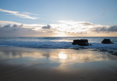 Scenic view of sea against sky at sunset