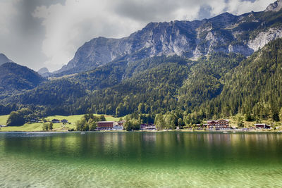 Scenic view of lake and mountains against sky