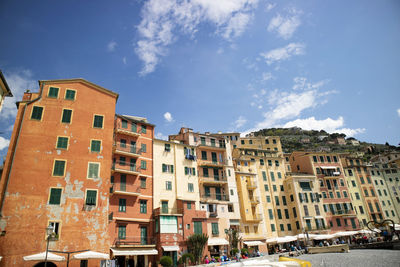 Buildings in city against sky