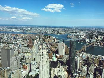 View of cityscape against blue sky