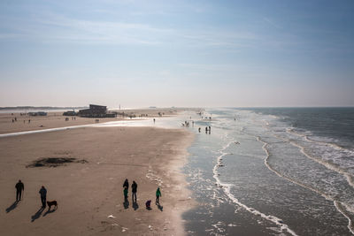 High angle view of people on beach against sky