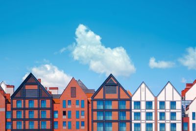 Low angle view of beach huts against sky