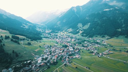 High angle view of townscape against mountain