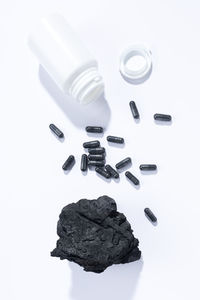 Close-up of pills on white background