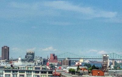 Buildings against cloudy sky