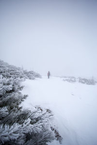 Scenic view of snow covered landscape against clear sky
