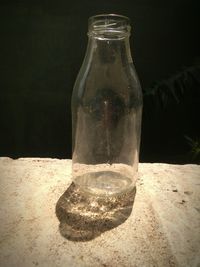 Close-up of glass bottle on table