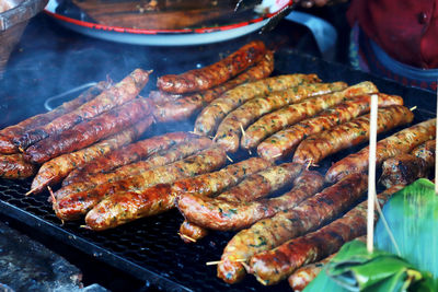 High angle view of meat on barbecue grill