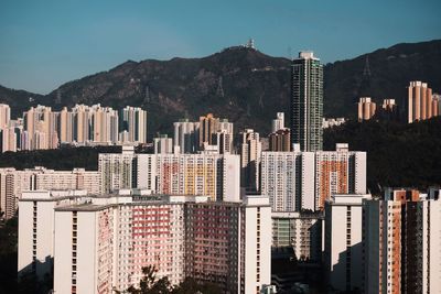 Buildings in city against sky