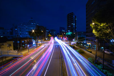 High angle view of light trails on road at night