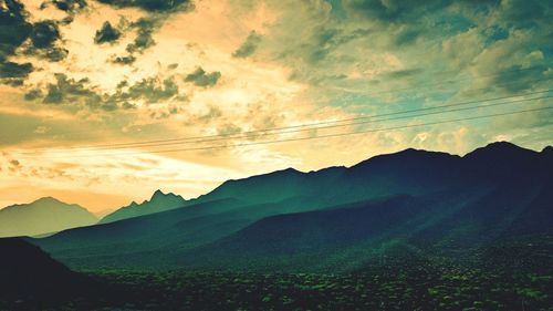 Scenic view of landscape against cloudy sky