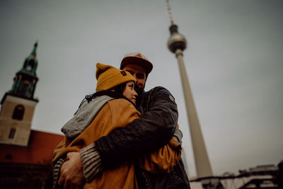 Couple embracing by fernsehturm 