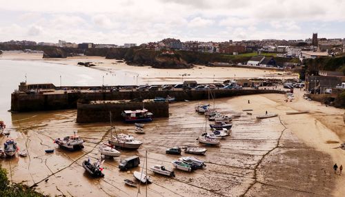 High angle view of boats moored in sea against sky