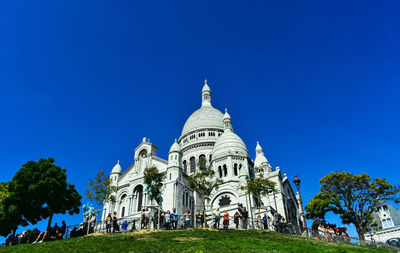 Low angle view of church against blue sky