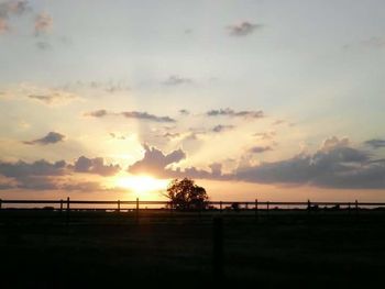 Scenic view of landscape at sunset