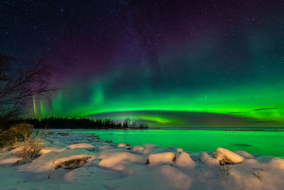 Scenic view of sea against sky at night