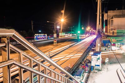 High angle view of railroad tracks at night