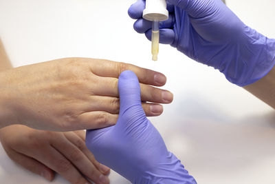 Cropped hand of doctor holding dental equipment