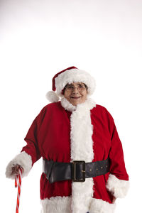 An old lady dressed as santa claus looking at the camera