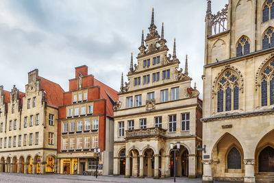 Low angle view of buildings in city against sky