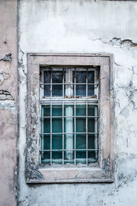 The old dilapidated wooden window frame.