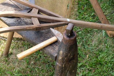 High angle view of wooden logs on field