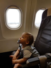 Toddler sitting in airplane