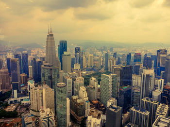 Aerial view of cityscape against sky during sunset