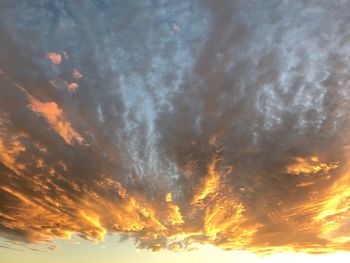 Low angle view of dramatic sky during sunset